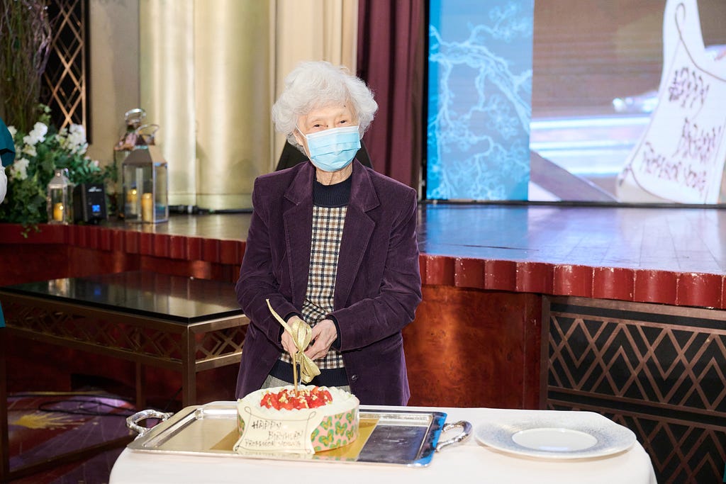 Professor Rosie Young cuts her birthday cake