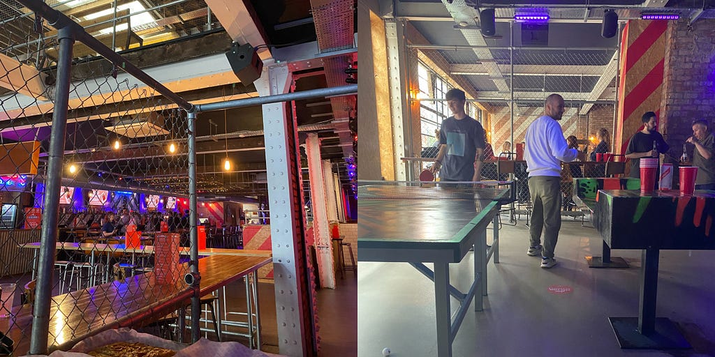Restaurant where the team social was held. One man playing ping pong, one man walking away from ping pong table.