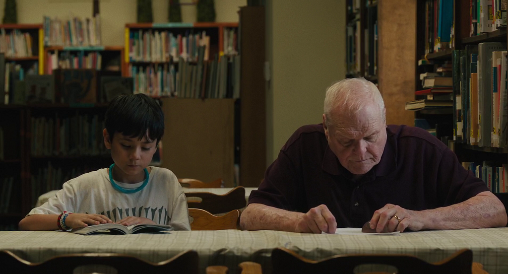 Cody and Del (Brian Dennehy) at the library