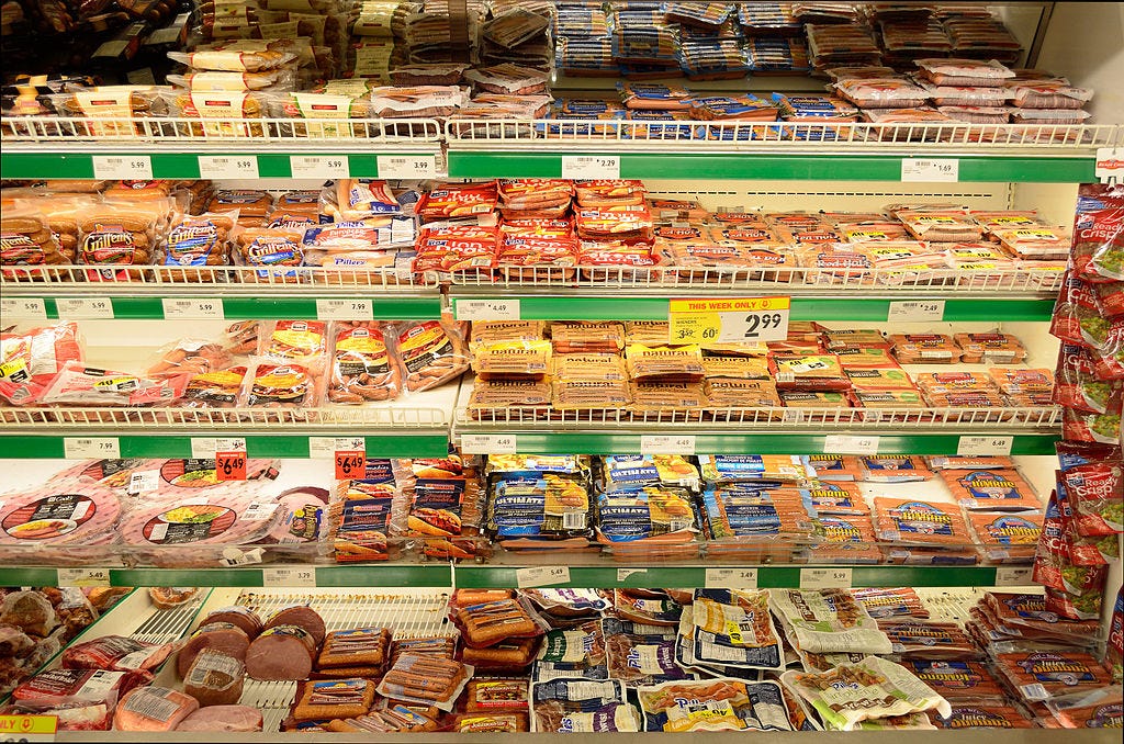 Processed meat products on display at a supermarket