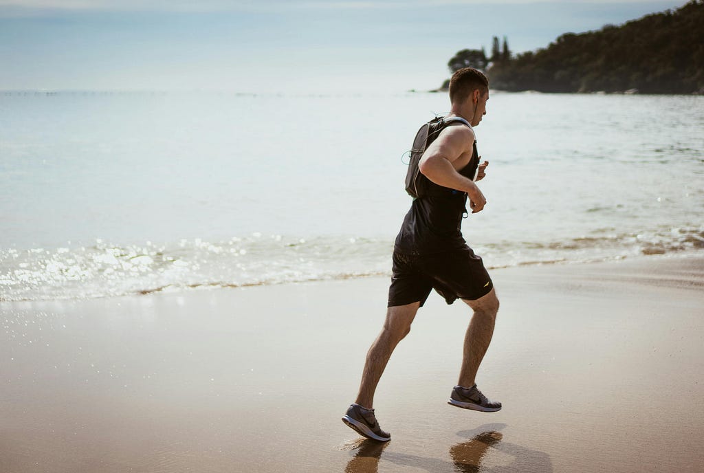 Man Jogging in Beach