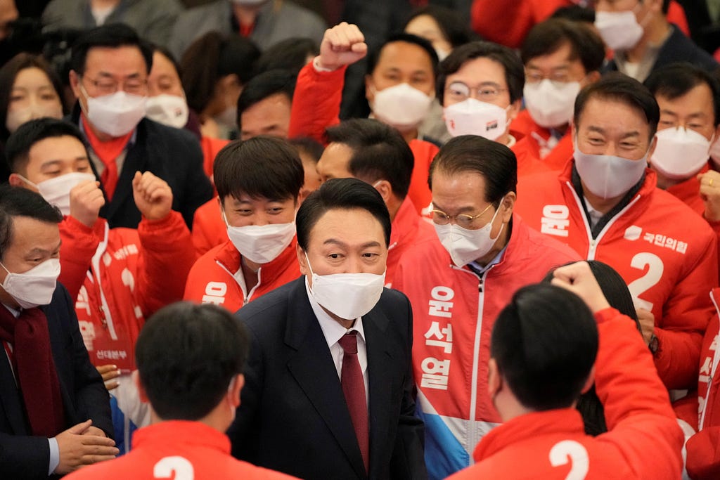 South Korean President-elect Yoon Seok-yeol is congratulated by party members and lawmakers at the National Assembly in Seoul, South Korea, March 10, 2022. Photo by Lee Jin-man/Pool via Reuters