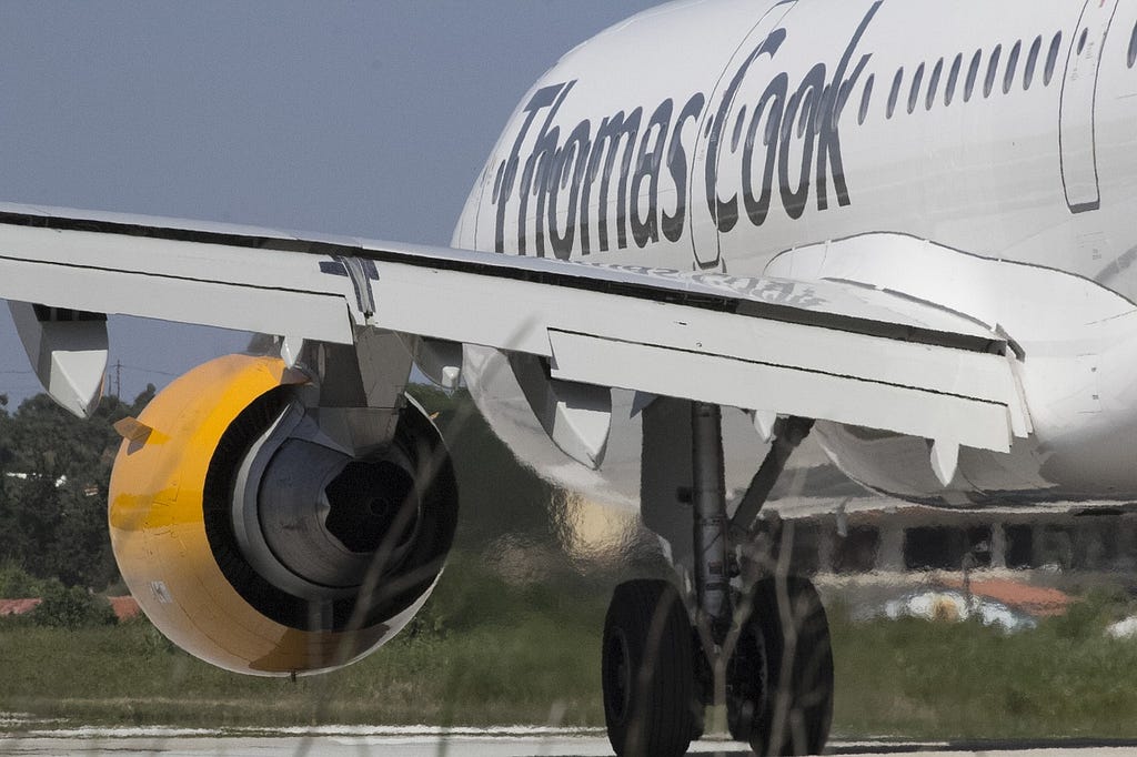 A plane labelled Thomas Cook showing the wing and engine