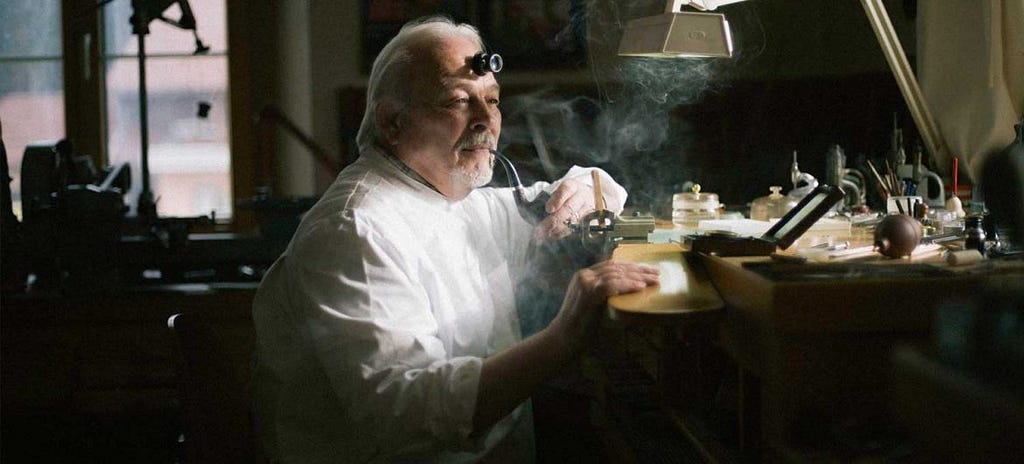 Photograph of Master Watchmaker Philippe Dufour in his workshop