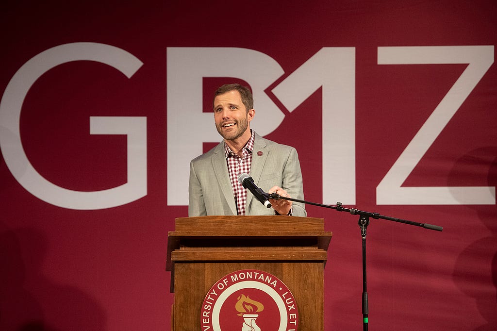 A picture of President Seth Bodnar before the Griz R1 sign.