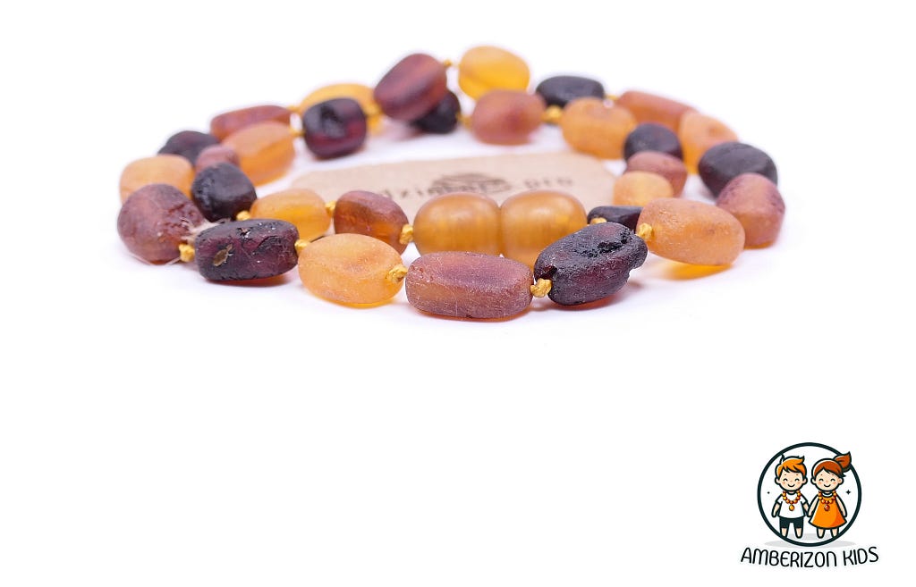 RAW AMBER TEETHING NECKLACE “FLAT OLIVE”. Raw unpolished Baltic amber beads (succinite). Purest and the most valued type of amber. Only the best necklaces for you baby. Children’s amber teething beads for baby boys and baby girls.