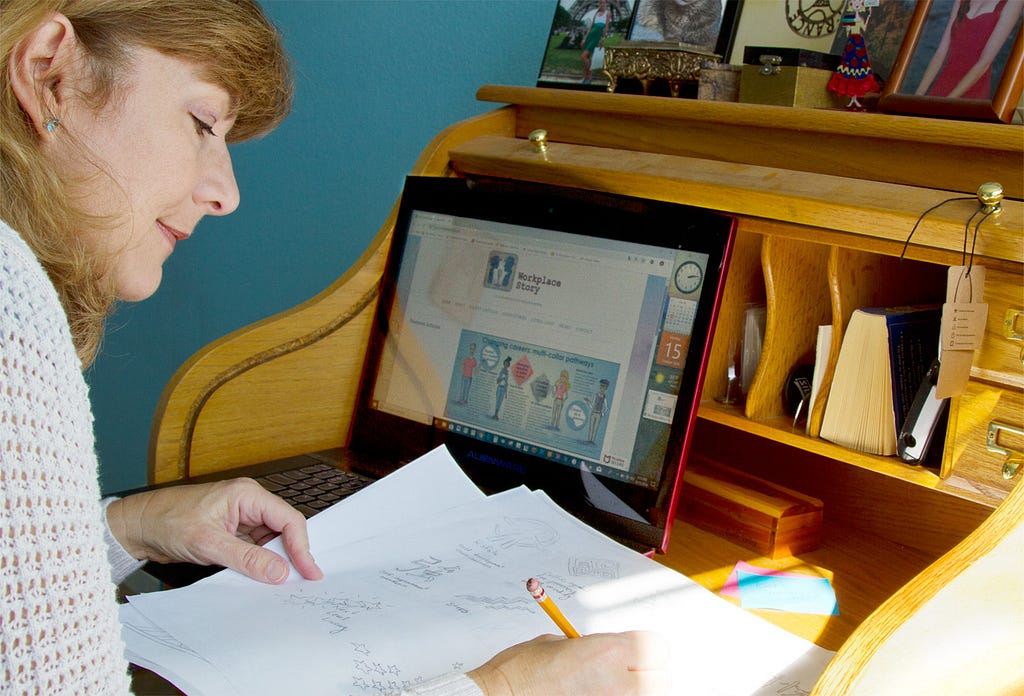 Photo of Woman Drawing Thumbnail Sketches for Freelance Graphic Design Work