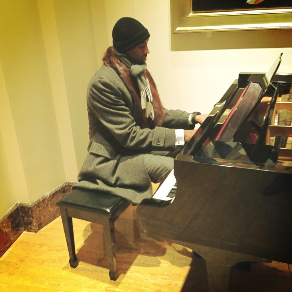 Kobe Bryant sitting and playing the Moonlight Sonata on the piano