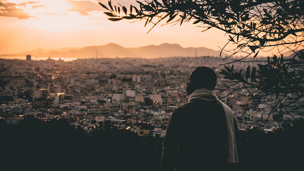 Safe Place community member at sunset overlooking Athens