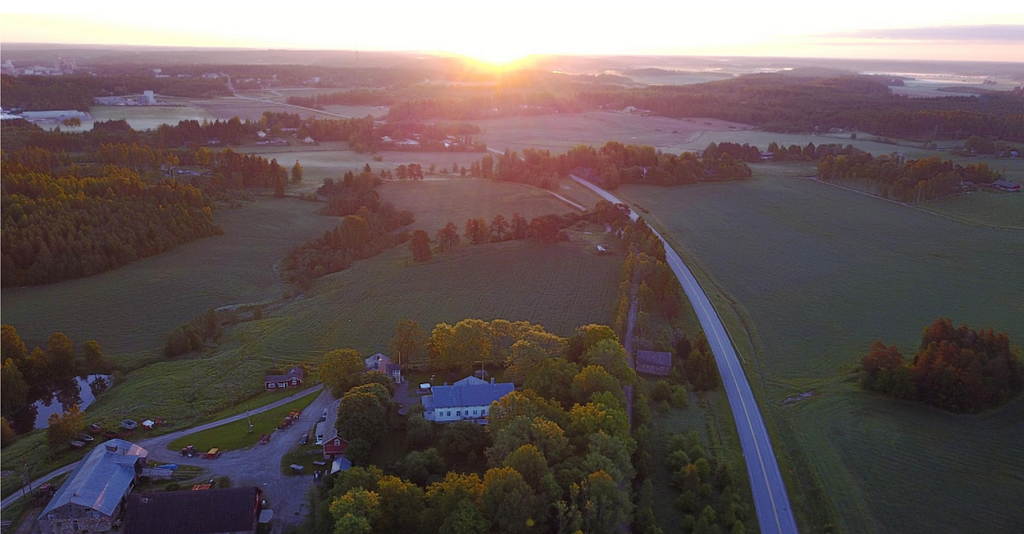 Aerial view of a farm at sunset — Max Schulman has managed his 400-year-old family farm, Stor-Tötar Gård, since 1986.