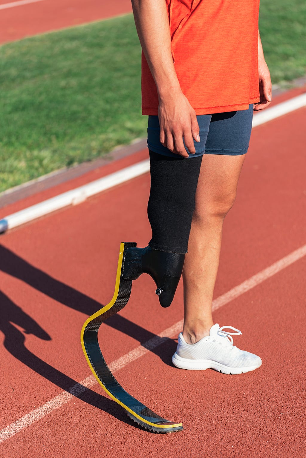 Close up of athlete with leg prosthesis.
