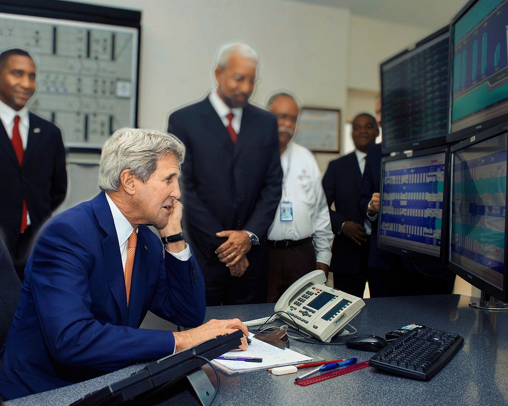 U.S. Department of State: “U.S. Secretary of State John Kerry clicks the mouse on a computer keyboard to close a gate at the Miraflores Locks in Panama City, Panama, on April 10, 2015, as the Secretary visited the historic transit way after joining President Obama in attending the Summit of the Americas.”