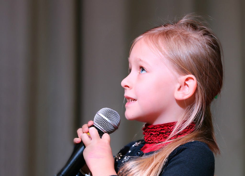 Nervous child performing on stage