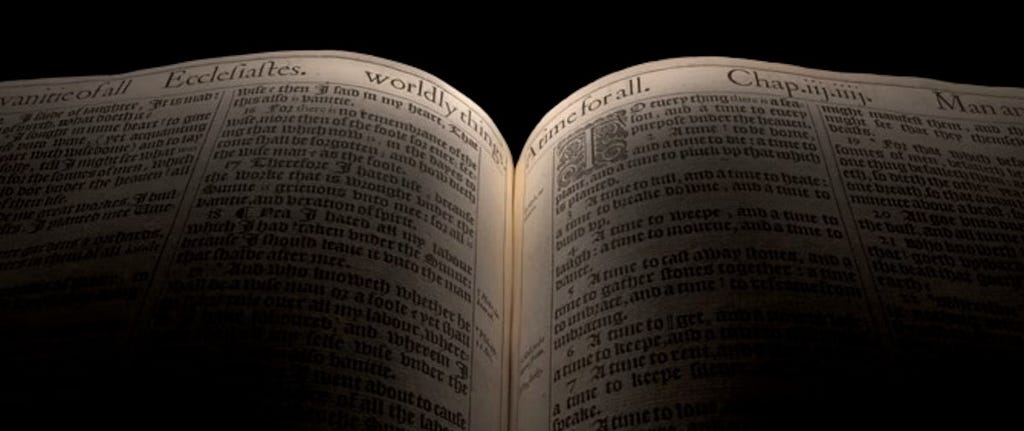 A close-up on the open pages of the King James Bible, with ethereal lighting
