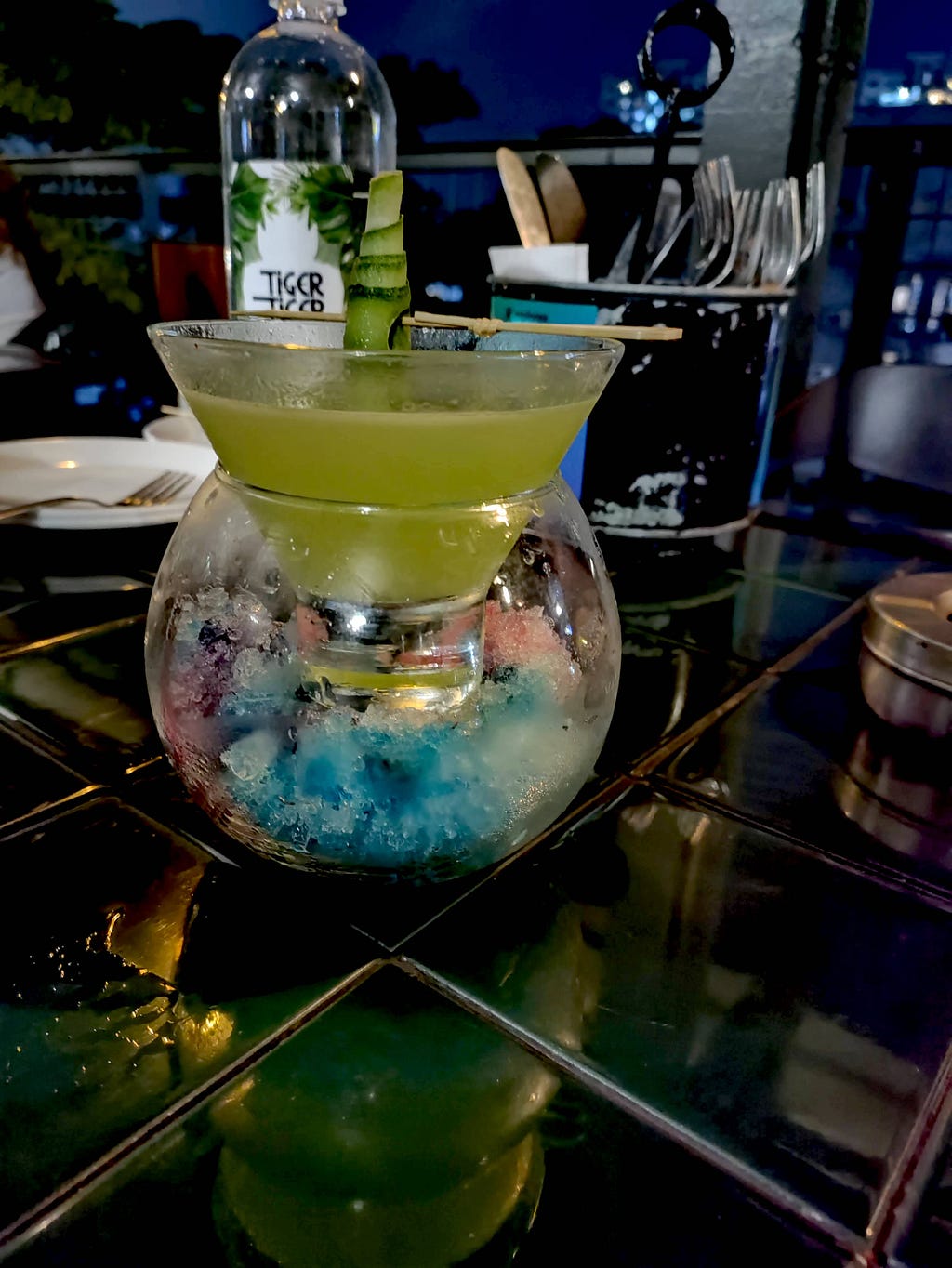 A cocktail drink that sits on a very coral like decoration