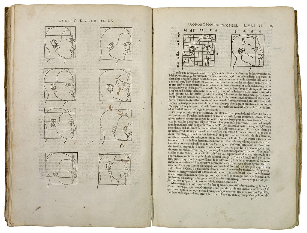 Pages of a book describing the proportions of different men’s faces. On the right, a Black man’s face is compared to a white man’s face by using grids.