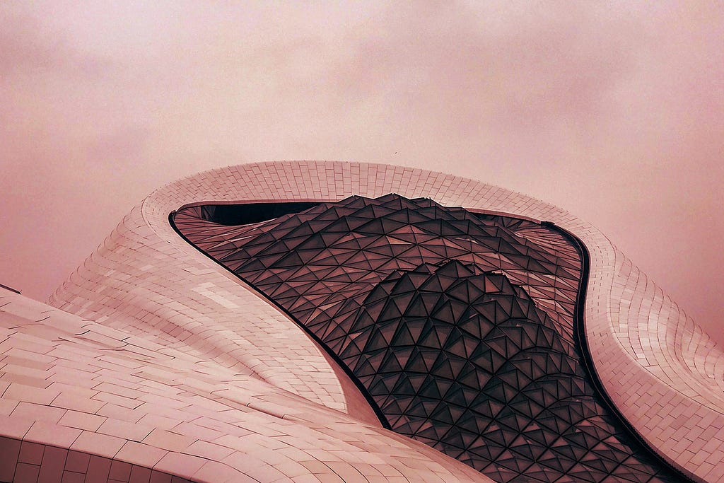 Close up of the Harbin Opera House overlaid with a red filter.