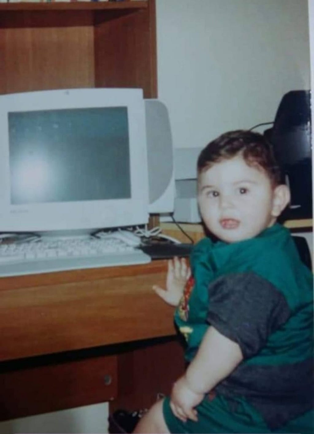 2-year-old me sitting on my father’s computer.