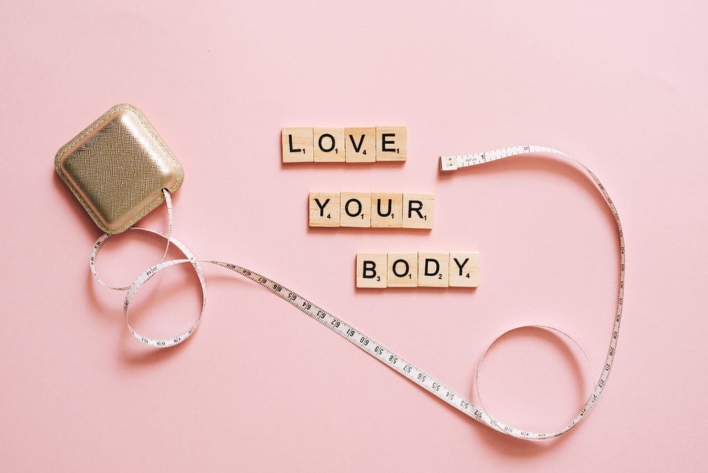 Tape measure and words “Love your body”