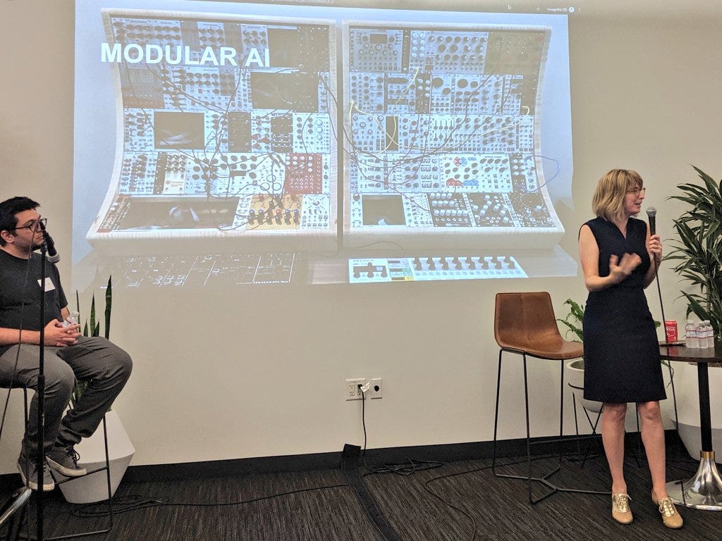 Christine from feminist.ai explaining modular.ai with image of modular.ai cables and parts in background