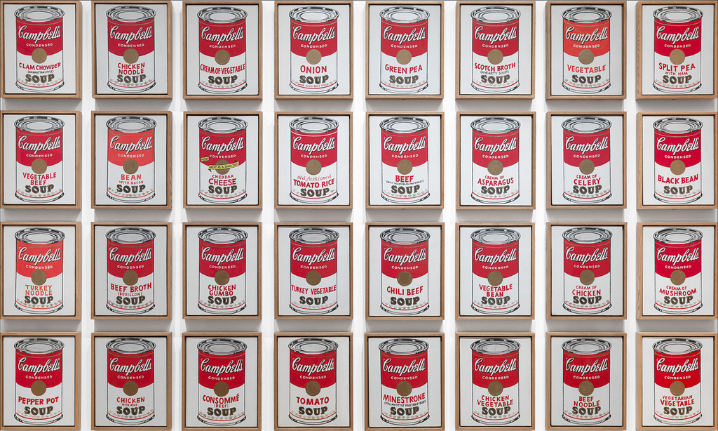 picture on a wall of Campbells soup cans.