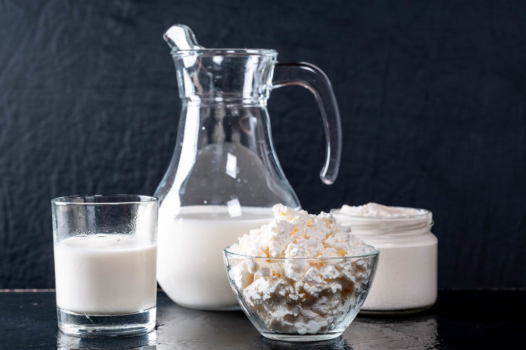 Dairy products, milk, butter, milk in glass and jug, butter in glass bowl