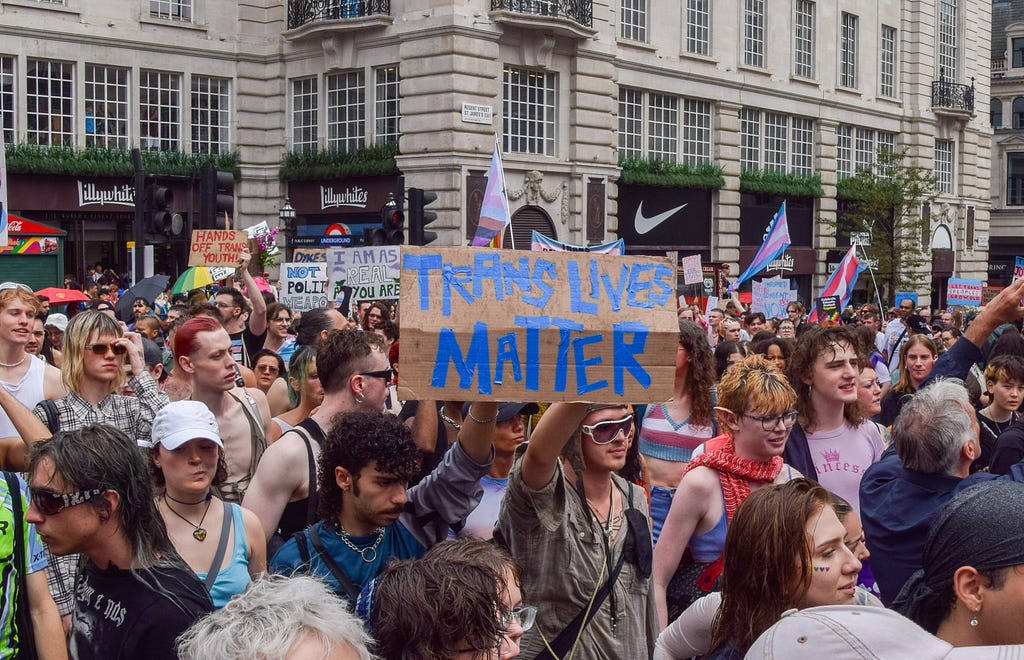 A protestor holds a placard saying ‘Trans Lives Matter’ as a crowd marches during the Trans Pride 2023 in London, U.K.