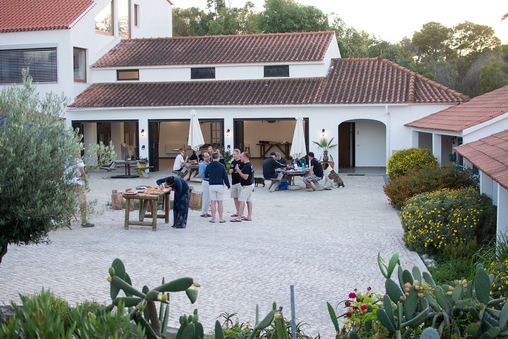 A wide shot of the Quinta grounds, with the Verifa team having dinner and talking