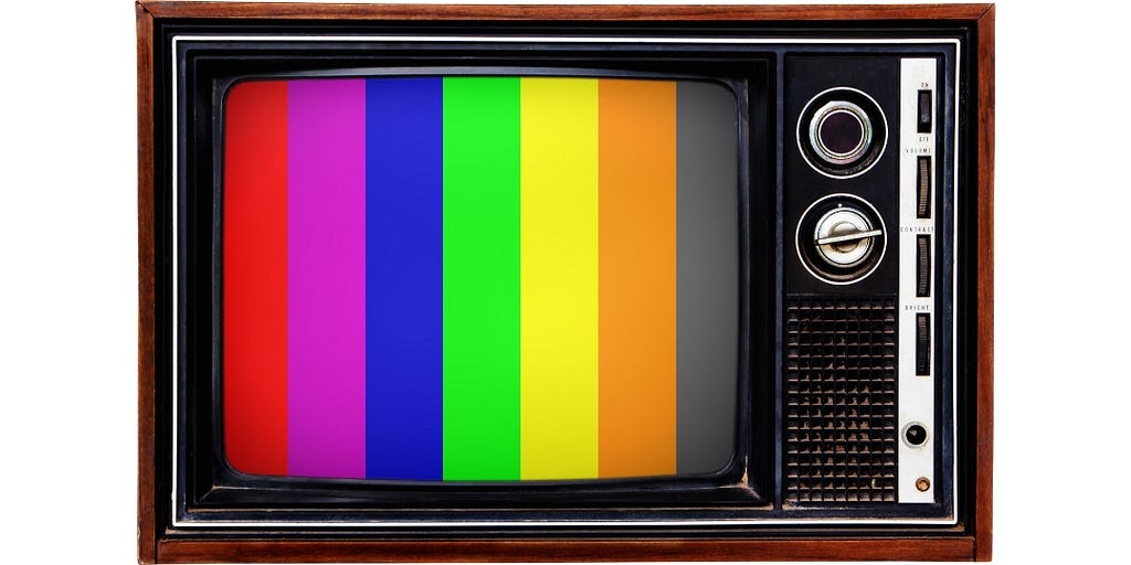 An old 1960s TV showing lines of color depicting the new age of color TV.