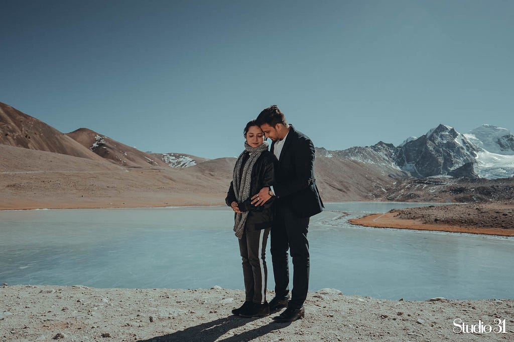 Creative couple portrait at Gurudongmar Lake, Sikkim by Studio 31