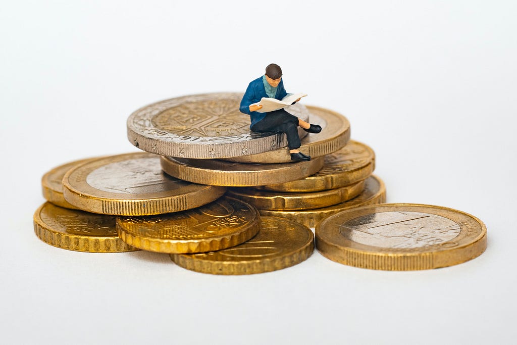 A man sitting on the coins.