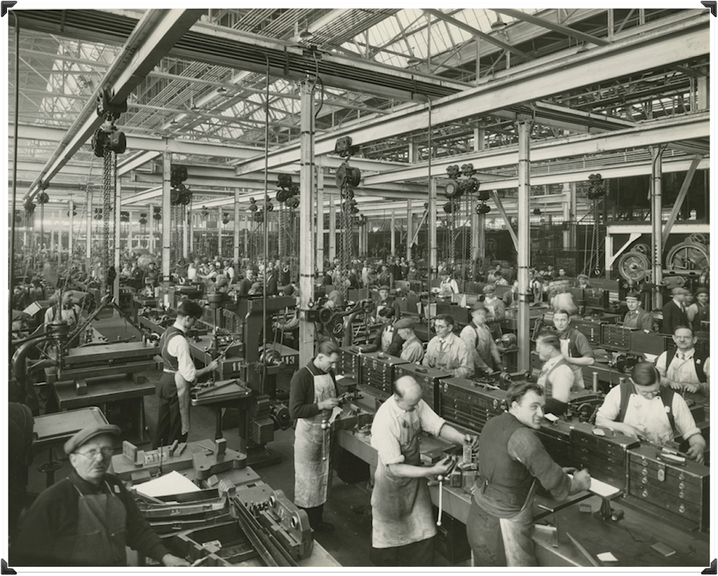 A factory floor from the early days at Ford where they standardized the production process through standardization and systems.