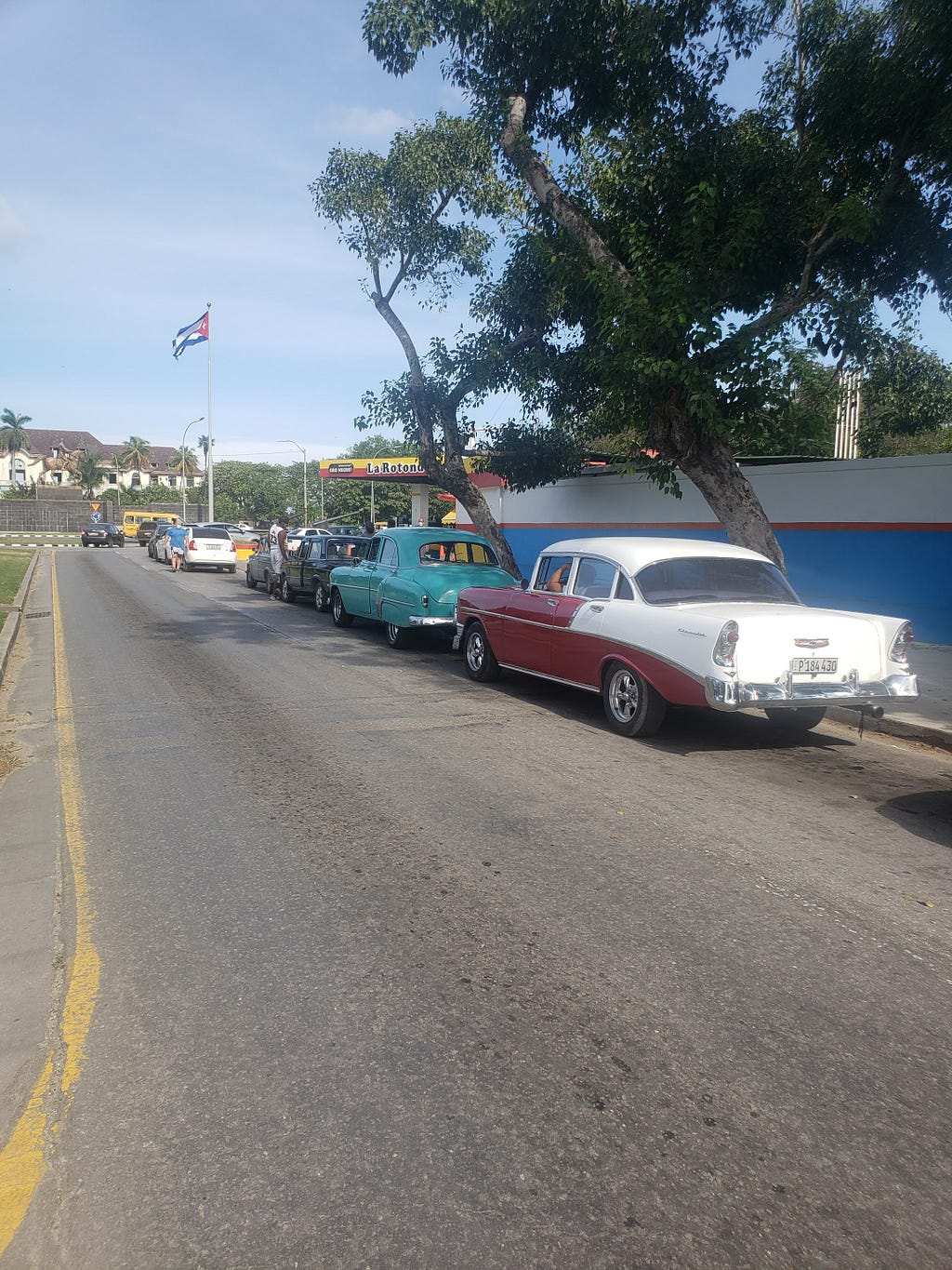 Line of cars on a street in Cuba