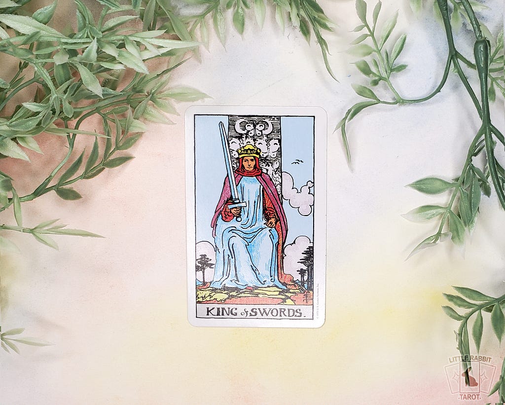 A photo of the King of Swords tarot card from the Rider Waite Smith Pocket Edition.