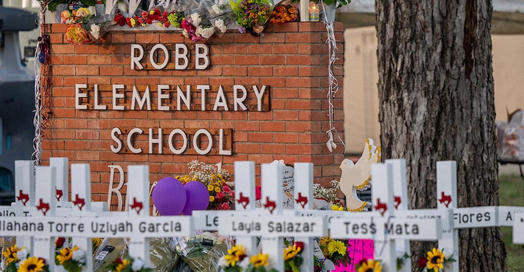 Front of Robb Elementary School in Uvalde, Texas with memorial crosses of the children and teachers massacred on May 24, 2022.