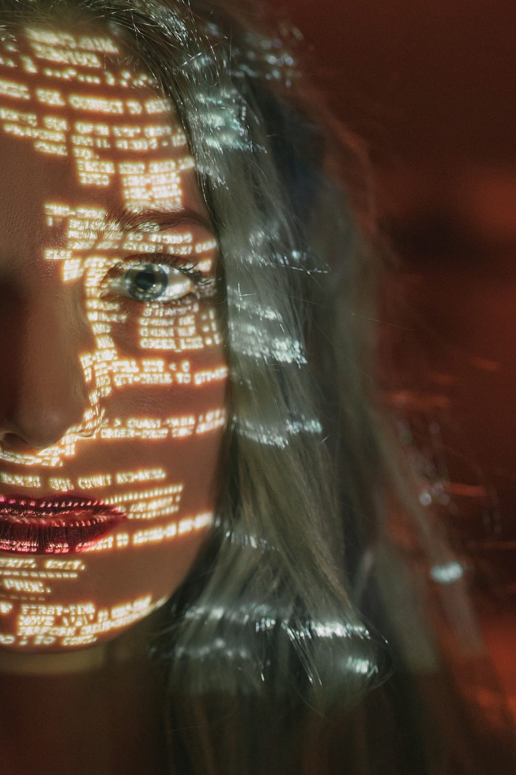 code being shown on a female human face