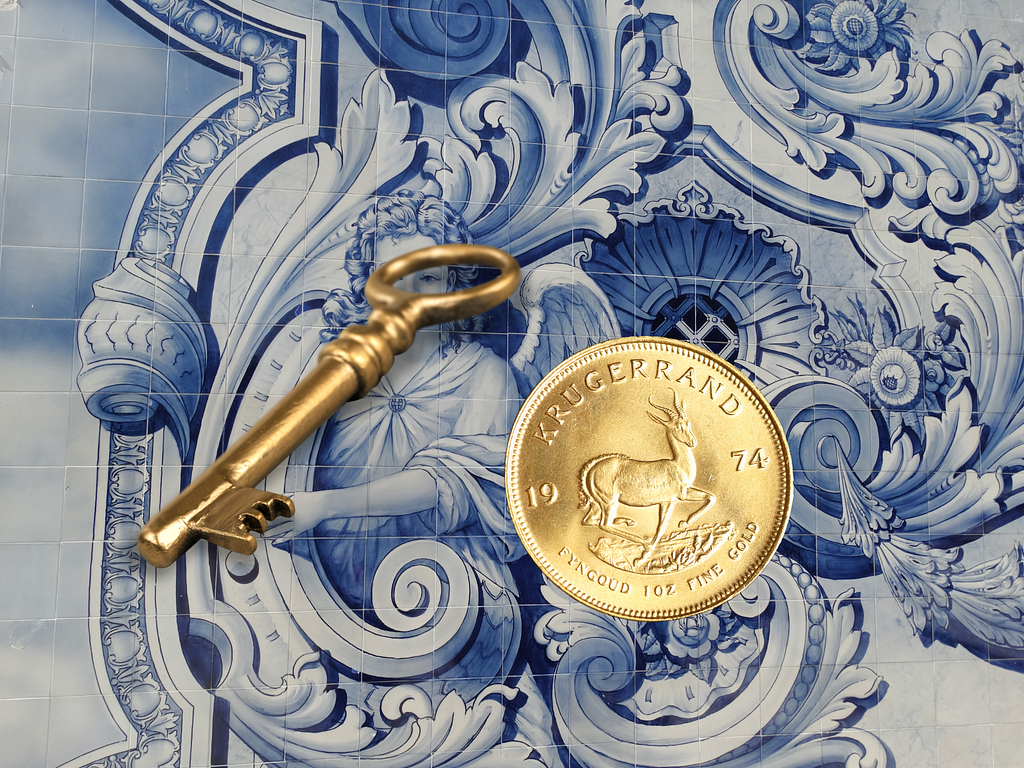 Image of a gold coin and a key