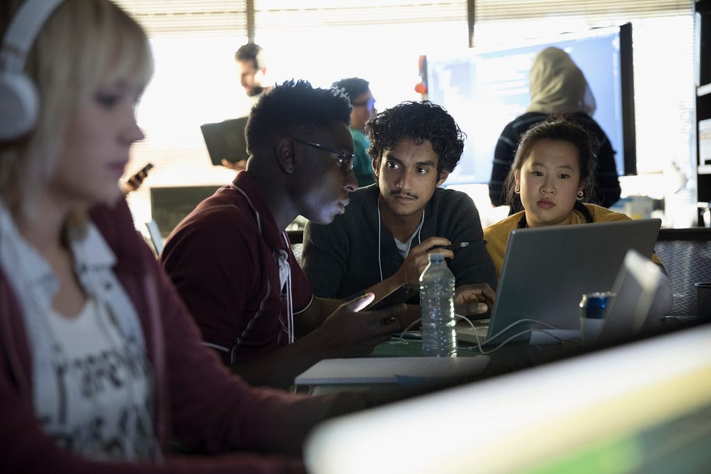 Group of people around computers