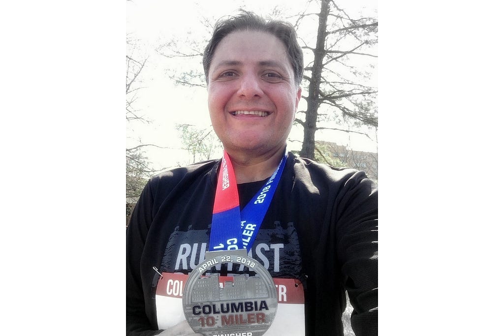 Author after finishing a 10-miler (Photo by the author, 2018).