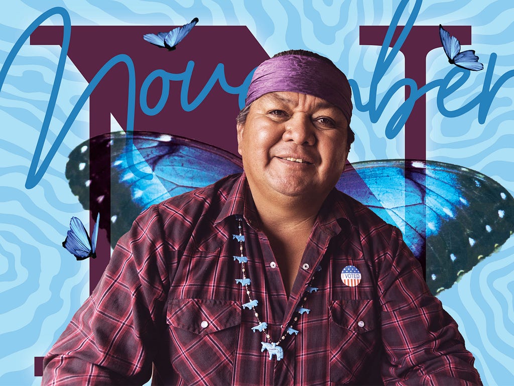 A Native American man with a plaid shirt and purple headband smiles at the camera. He is wearing an “I Voted” button. The photo collage surrounds him with blue butterflies and a water-like pattern, while a stoic N in serif font anchors the portrait. The word November is written in blue handwriting across the top of the image.