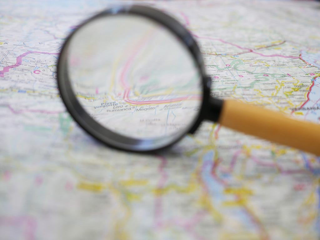 Map and magnifying glass