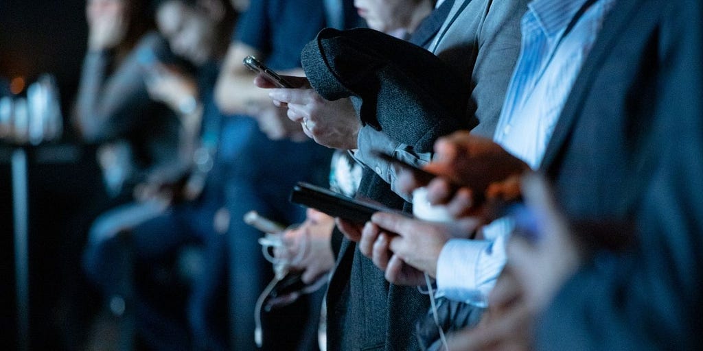 People using their smartphones