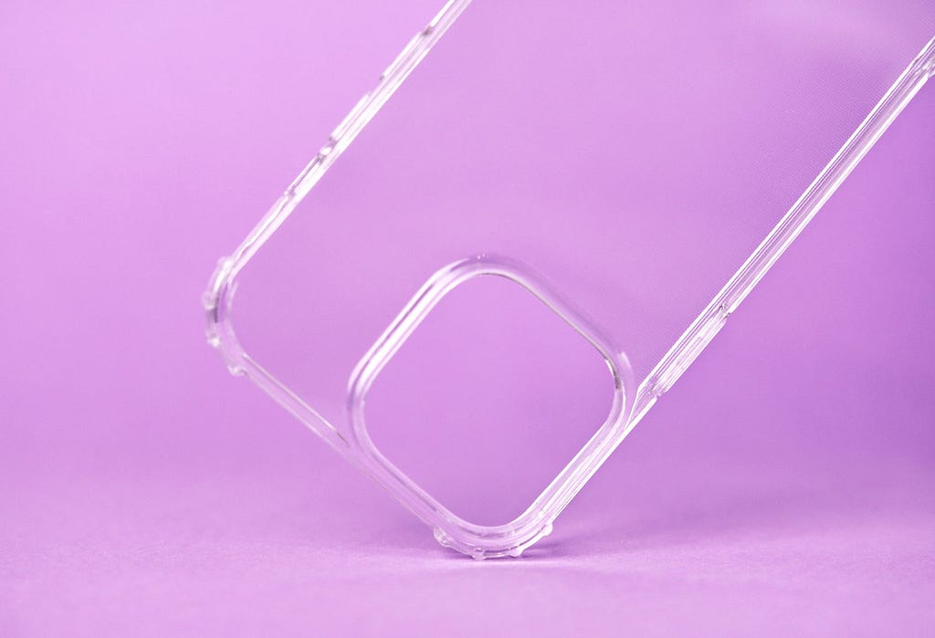 This phone case over a pink background is made of thermoplastic polyurethane injected in a complex mold.