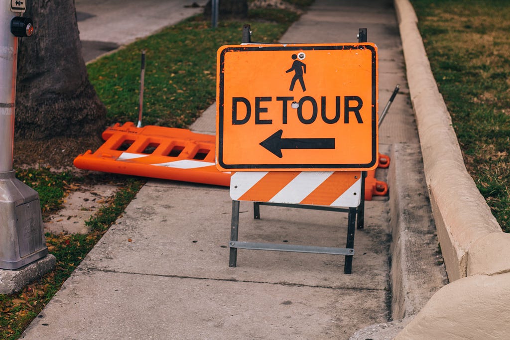 Detour sign on footpath