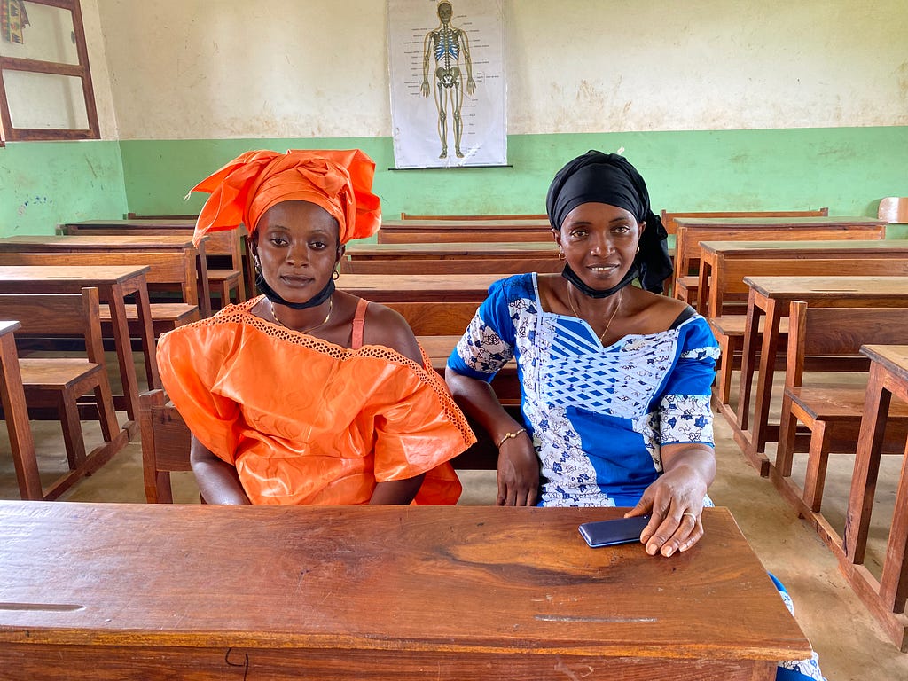 Abi and Cadi sat side by side in the classroom of one of the elementary schools in Mansabá.