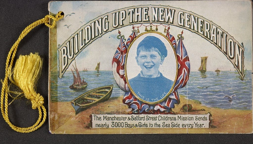 Postcard depicting a happy boy at seaside with the caption ‘building up the new generation’