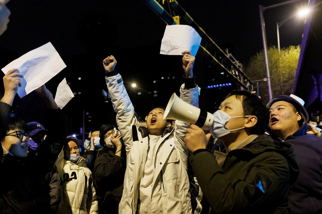People protest against COVID-19 restrictions after a vigil for the victims of a fire in Urumqi, in Beijing, China, November 28, 2022. Photo by Thomas Peter/Reuters