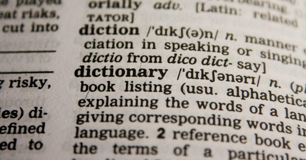 A close up of a dictionary definition page.