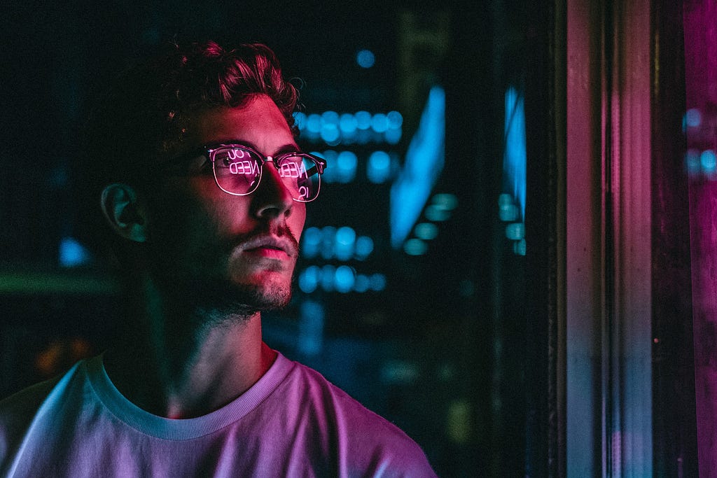 Men watching colorful window