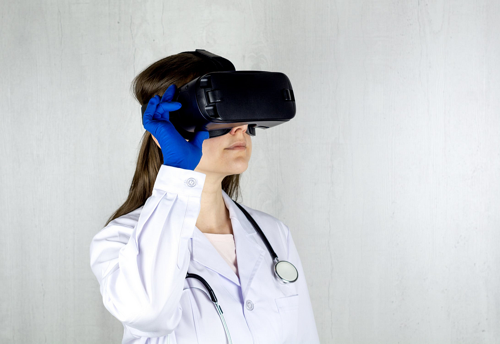 A doctor using a VR device to help a patient overcome their phobia